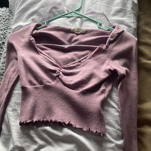 A cute pink top from Pacsun. It is in perfect condition!